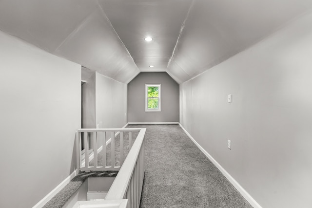 bonus room featuring carpet flooring and lofted ceiling