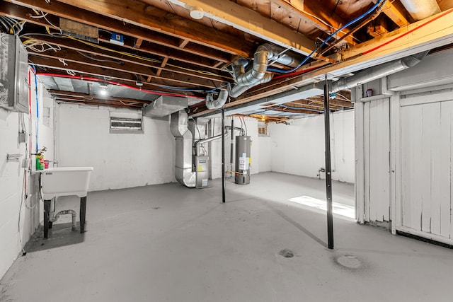 basement featuring heating unit and gas water heater