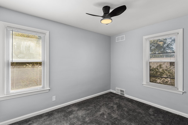 carpeted empty room featuring ceiling fan