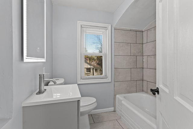 full bathroom featuring tile patterned flooring, vanity, toilet, and tiled shower / bath