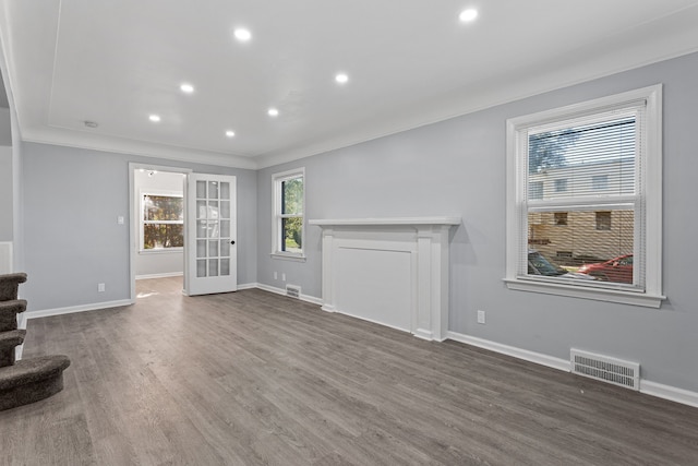 living room featuring french doors, dark hardwood / wood-style flooring, and ornamental molding