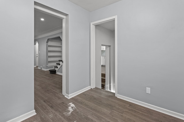 corridor featuring dark wood-type flooring