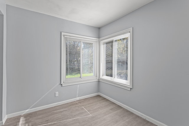 unfurnished room featuring light wood-type flooring