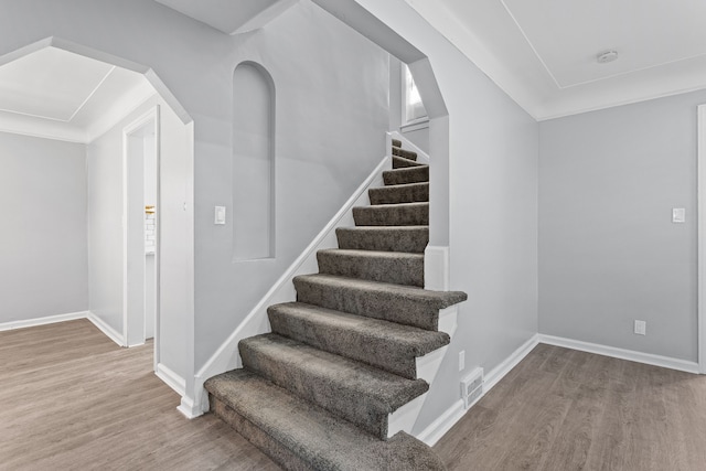 staircase featuring hardwood / wood-style floors