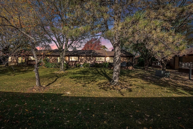 view of front of home with a lawn