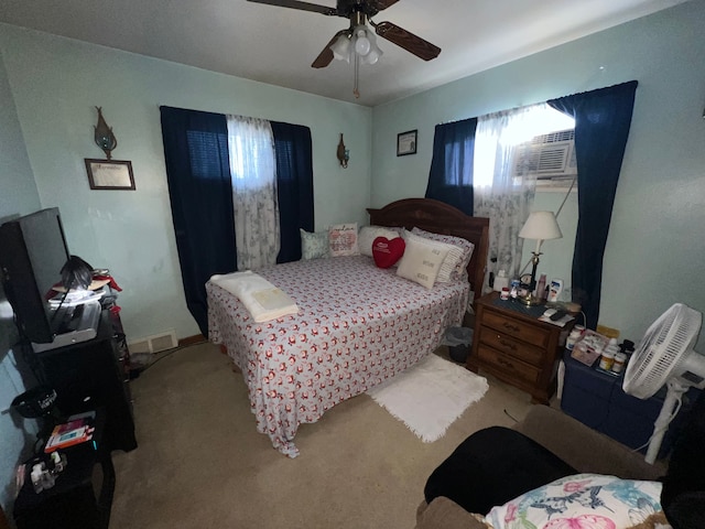 bedroom with ceiling fan and light colored carpet