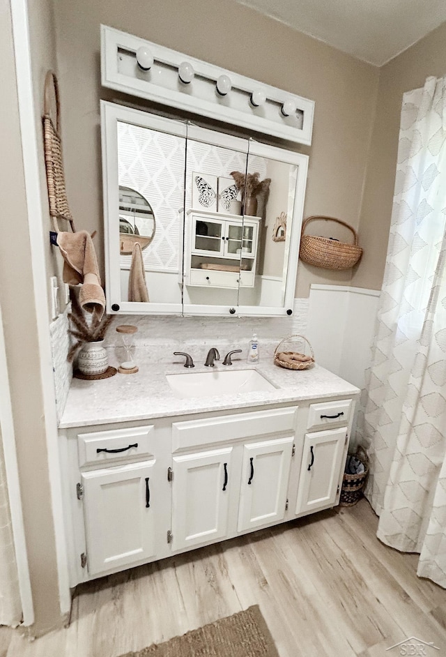 bathroom featuring hardwood / wood-style floors and vanity