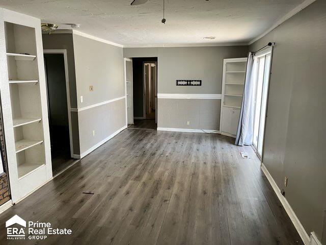 interior space featuring hardwood / wood-style floors and ornamental molding