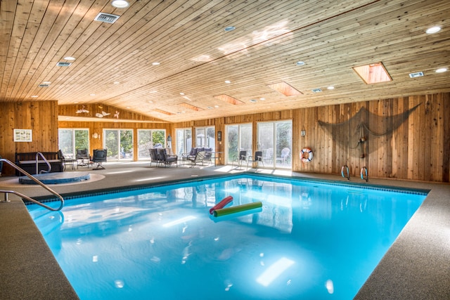 view of pool featuring a skylight