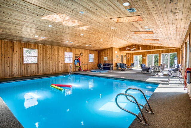 view of pool featuring a skylight