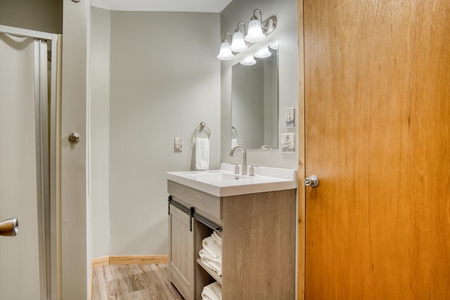 bathroom featuring hardwood / wood-style floors and vanity