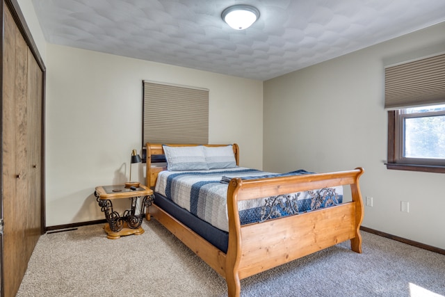 carpeted bedroom with a closet