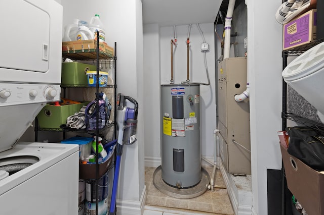 utility room with electric water heater and stacked washer and clothes dryer