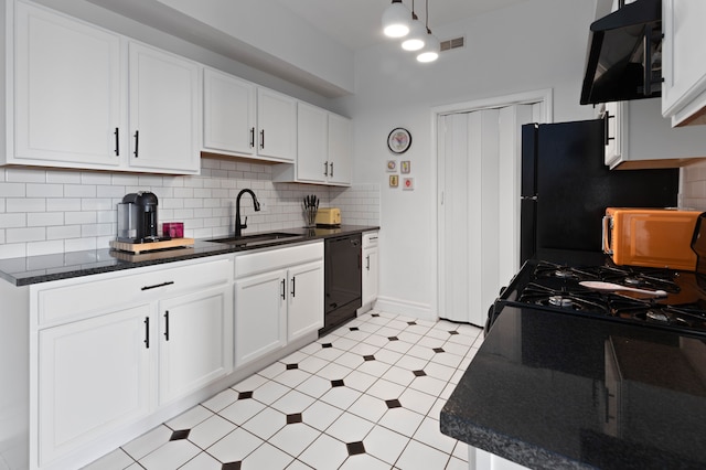 kitchen with sink, tasteful backsplash, white cabinetry, and black appliances