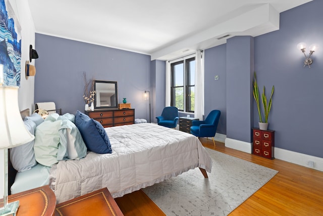 bedroom featuring wood-type flooring