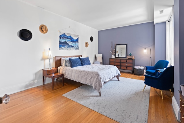 bedroom with hardwood / wood-style flooring