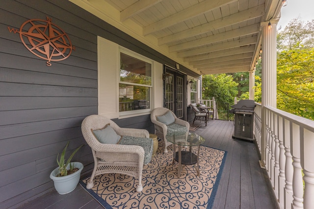 wooden deck featuring grilling area