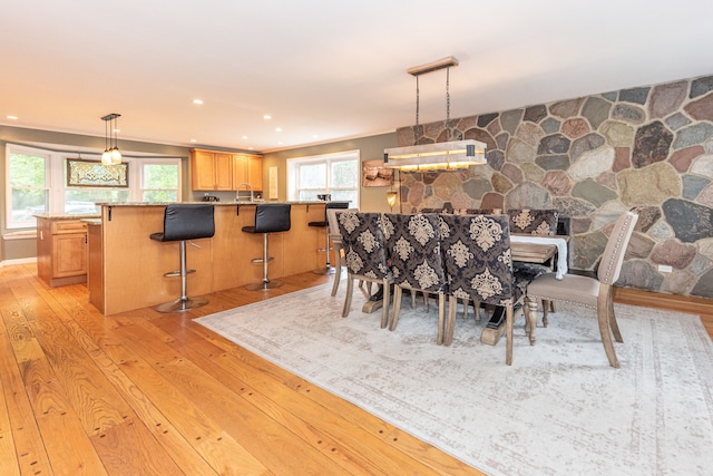 dining area with light wood-style flooring and recessed lighting