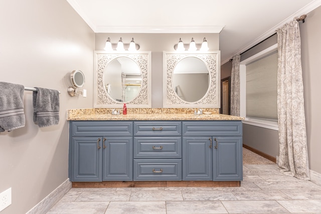 bathroom with double vanity, ornamental molding, and baseboards