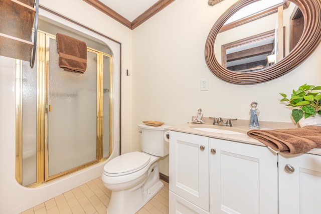 full bath featuring tile patterned flooring, toilet, vanity, a shower stall, and crown molding