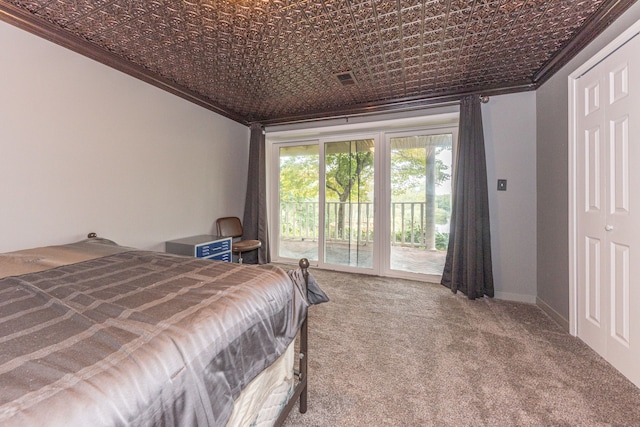 carpeted bedroom featuring visible vents, baseboards, an ornate ceiling, access to exterior, and crown molding