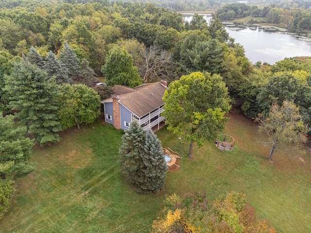 bird's eye view with a water view and a view of trees