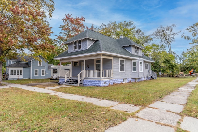 view of front facade featuring a porch and a front lawn