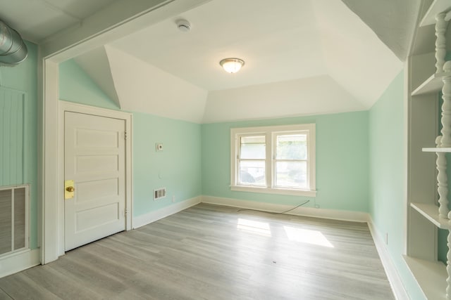 interior space featuring light hardwood / wood-style flooring and lofted ceiling