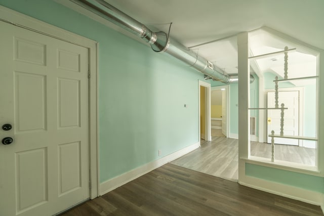 spare room featuring wood-type flooring