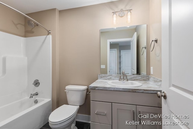 bathroom with toilet, shower / bath combination, and vanity