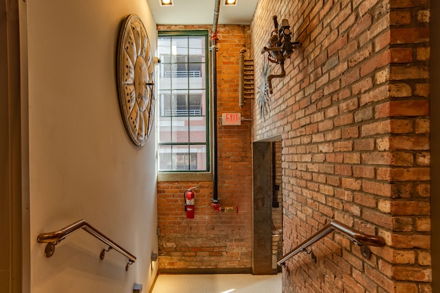 interior space featuring brick wall