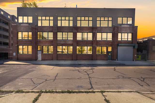 outdoor building at dusk with a garage