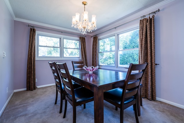 carpeted dining space with a chandelier, a textured ceiling, and ornamental molding