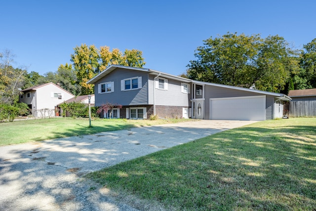 view of front of home with a garage and a front lawn