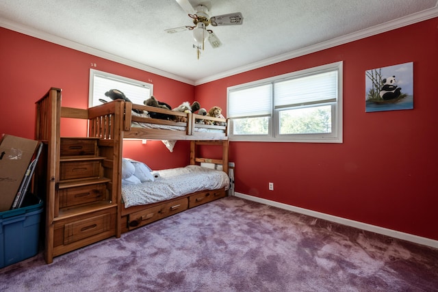 carpeted bedroom featuring a textured ceiling, multiple windows, crown molding, and ceiling fan