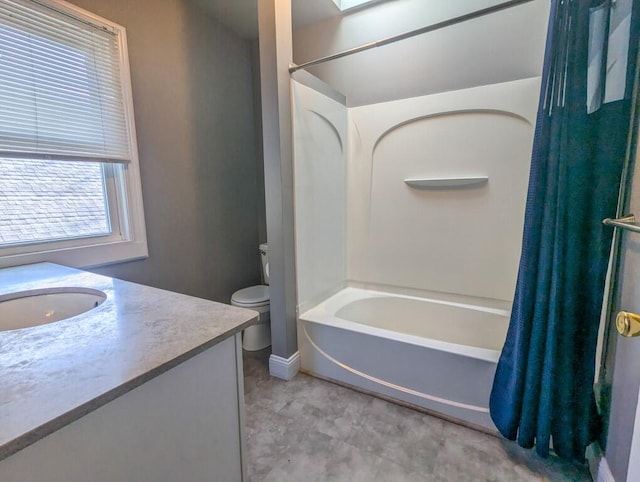 full bathroom with vanity, shower / bath combination with curtain, and toilet