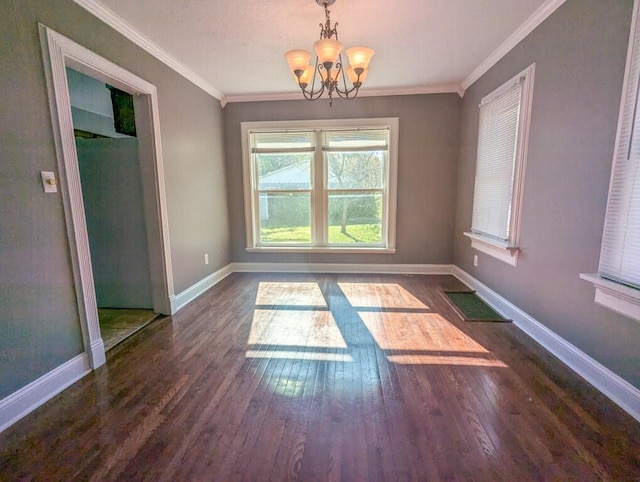 unfurnished dining area featuring dark hardwood / wood-style flooring, ornamental molding, and a notable chandelier