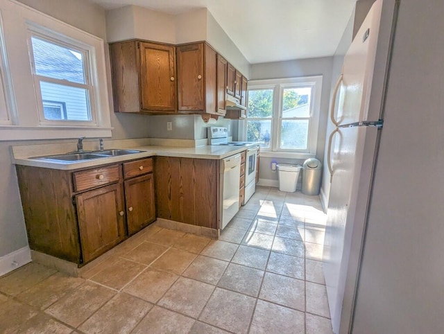 kitchen with white appliances and sink