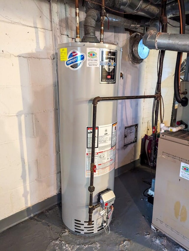 utility room with gas water heater