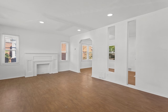 unfurnished living room with hardwood / wood-style flooring