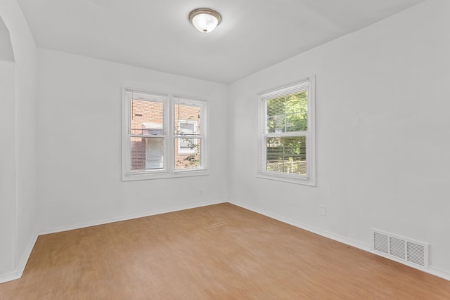 unfurnished room with light hardwood / wood-style flooring