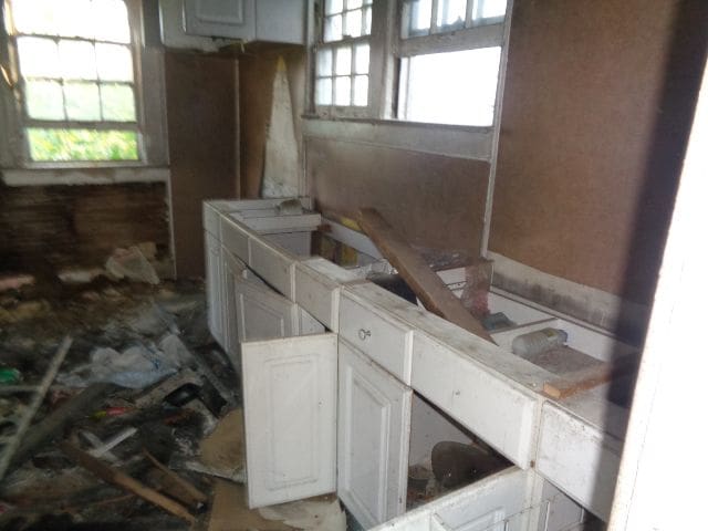 kitchen featuring white cabinetry and a wealth of natural light