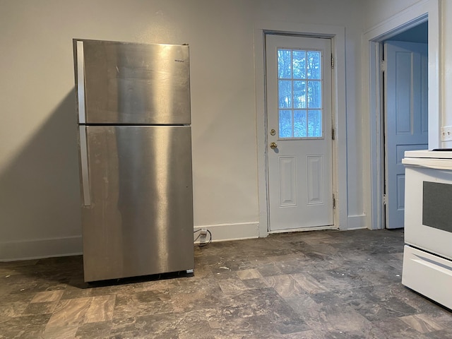 kitchen with stainless steel fridge and stove