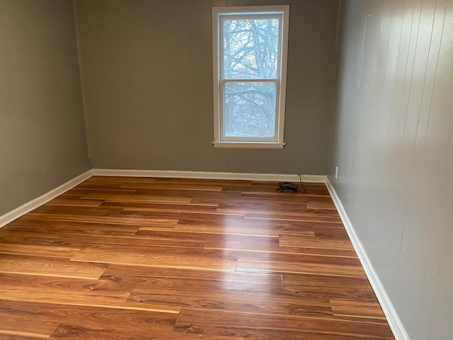 spare room with hardwood / wood-style flooring