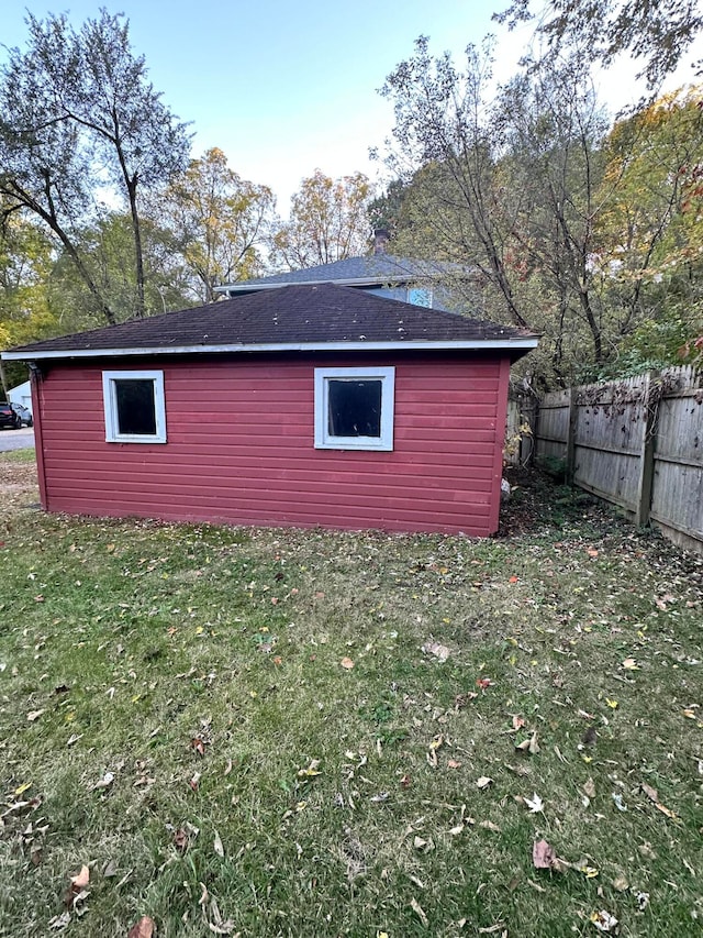 view of outdoor structure with a lawn