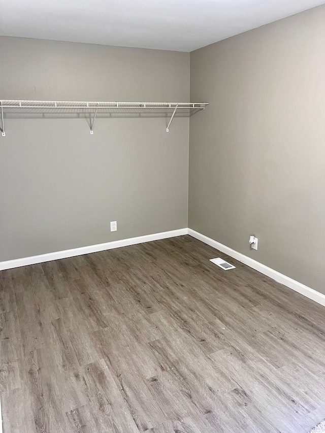 spacious closet featuring hardwood / wood-style floors