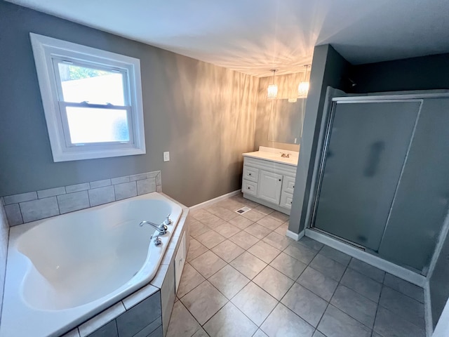 bathroom with shower with separate bathtub, vanity, and tile patterned floors