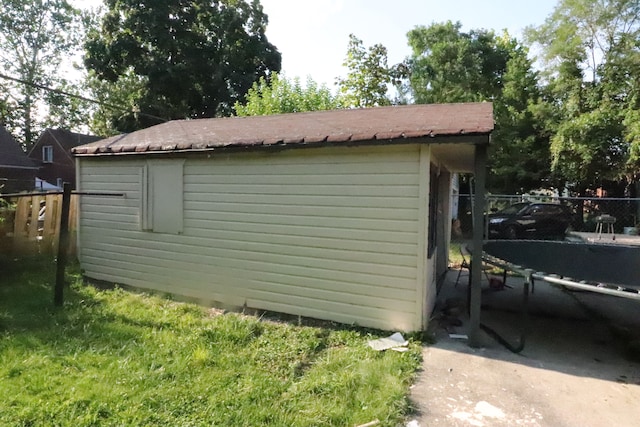 view of property exterior featuring a storage unit