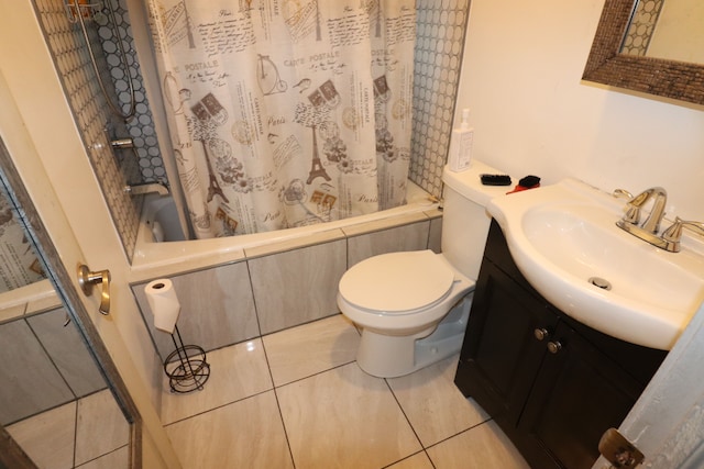 full bathroom with tile patterned flooring, shower / tub combo, vanity, and toilet