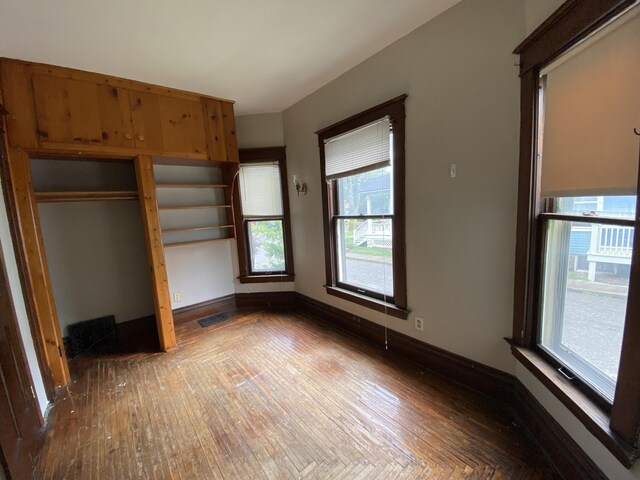 925 W Lovell St, Kalamazoo, MI 49007 - unfurnished bedroom with wood finished floors and baseboards